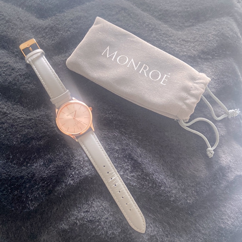 Ladies Watch. Grey colour band and rose coloured watch face